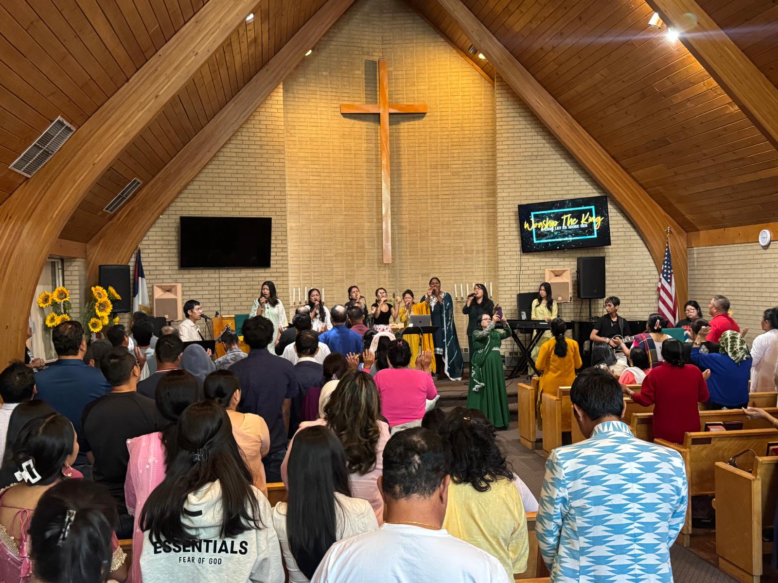 Congregation worshipping together at Restoration International Ministries in Aurora