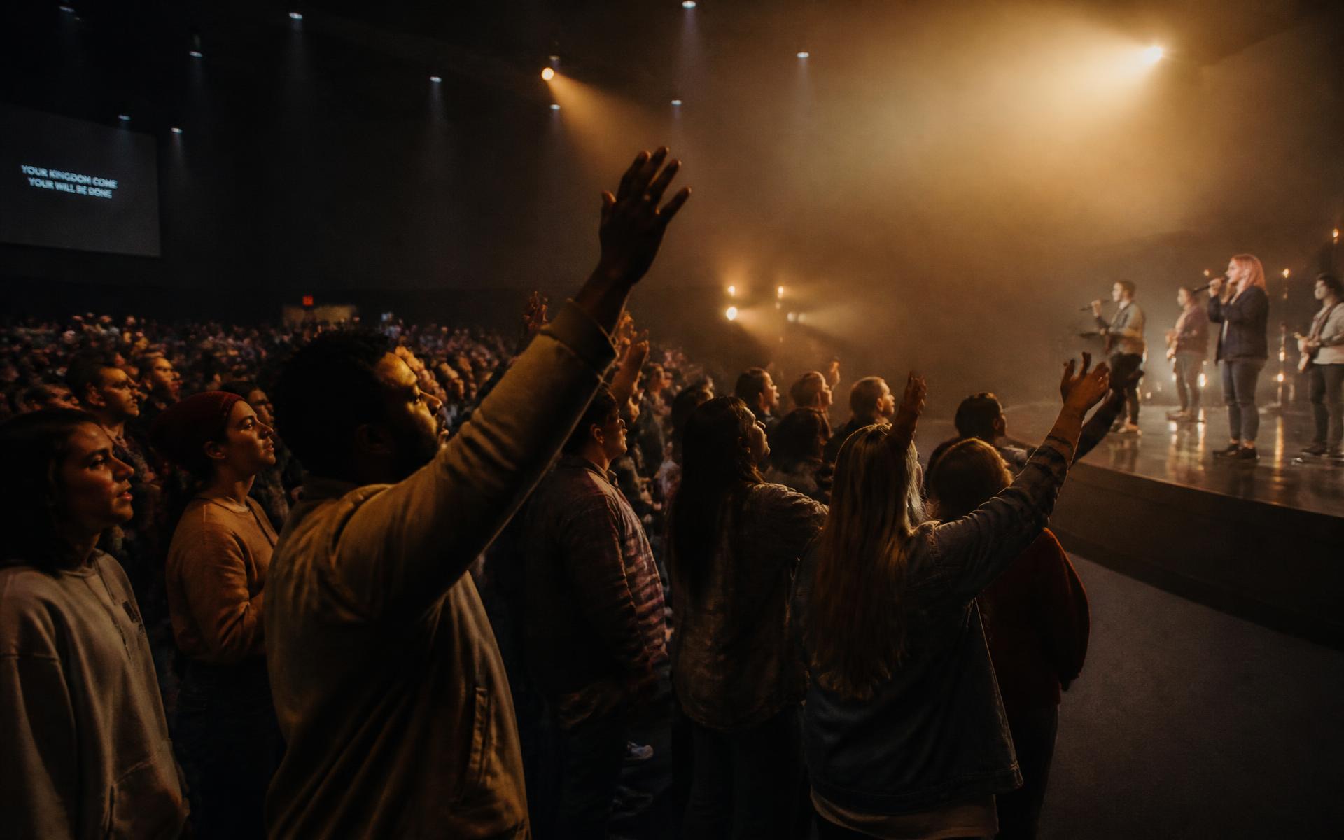 Congregation worshipping together at Restoration International Ministries in Aurora